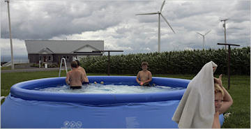 Maple Ridge wind farm and nearby family (Mike Groll/Associated Press)